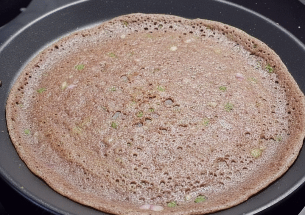 No-Oil Ragi Masala Dosa (Healthy Version) raagi dosa on pan